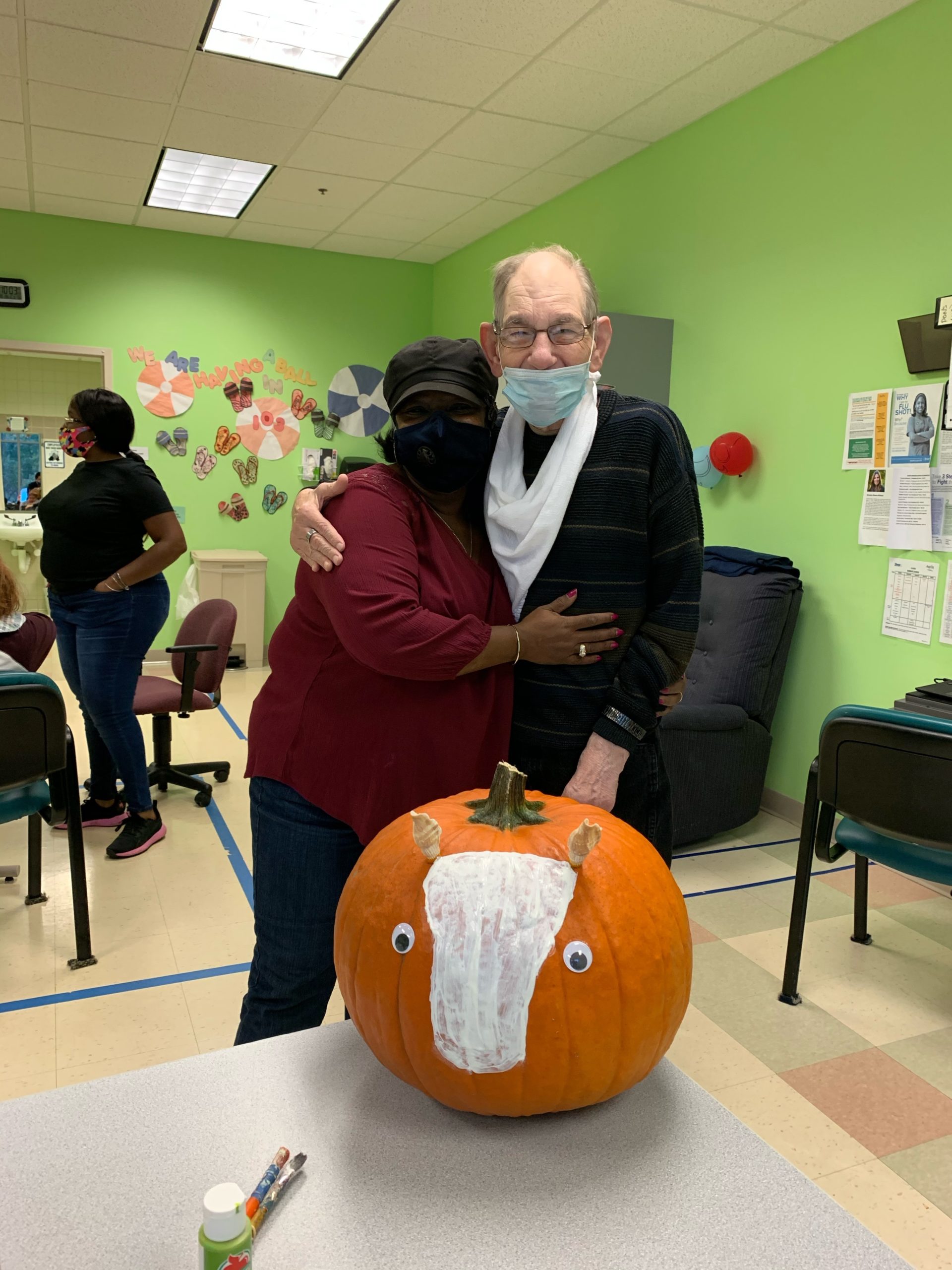 Family Support Services - Aspire - Man and Woman with Decorated Pumpkin