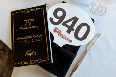 75th gala auction paddle and program